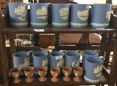 A collection of Wedgwood souvenir mugs.