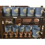 A collection of Wedgwood souvenir mugs.