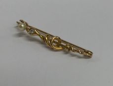 A diamond brooch in the form of an entwined snake.