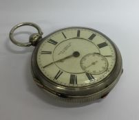 A gent's open face pocket watch with white enamell