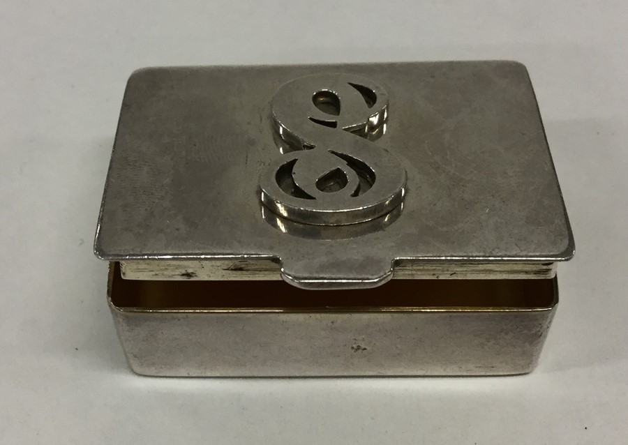 A small rectangular hinged top box with gilt inter