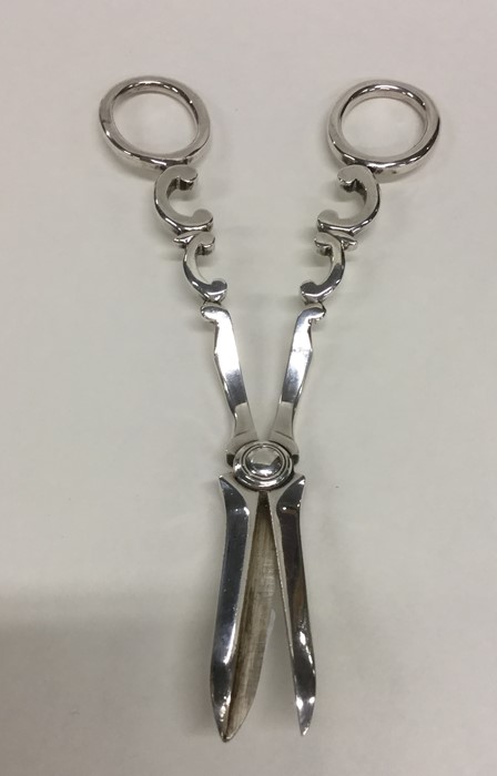 A good pair of Edwardian silver grape scissors wit