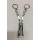 A good pair of Edwardian silver grape scissors wit