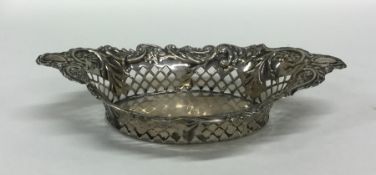 A small oval silver embossed sweet dish. Sheffield