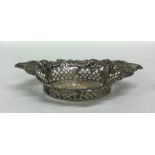 A small oval silver embossed sweet dish. Sheffield