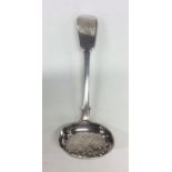 A silver fiddle pattern sifter spoon with pierced