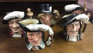 Five Royal Doulton Toby jugs.