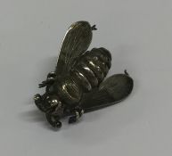 An unusual silver brooch in the form of a bumble b