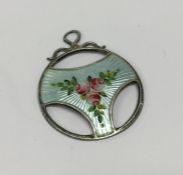 A small silver and enamel Charles Horner pendant d