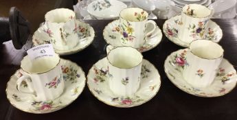 A decorative Royal Worcester coffee cups and sauce