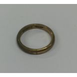 A 9 carat plain wedding band. Approx. 3.3 grams. E