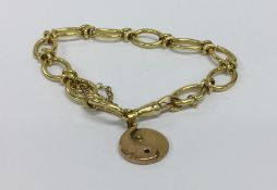 An 18 carat fancy link bracelet with ring clasp. A