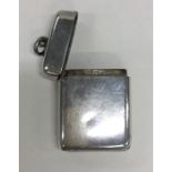 A novelty silver hinged vesta with locket interior