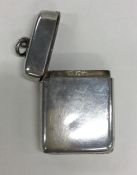 A novelty silver hinged vesta with locket interior