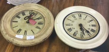 Two old enamelled school clocks.