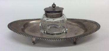 An Edwardian silver boat shaped inkwell with gadro