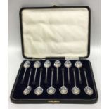 A boxed set of twelve bean top silver coffee spoon