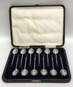 A boxed set of twelve bean top silver coffee spoon