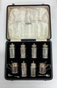 A good quality heavy boxed silver eight piece crue