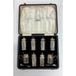 A good quality heavy boxed silver eight piece crue