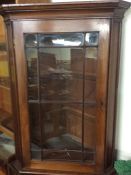 A Georgian mahogany corner cupboard.