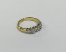 A heavy 18 carat two colour gold diamond six stone