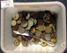 A quantity of coinage and cap badges.