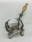 An unusual Queen Anne silver kettle stand and burn