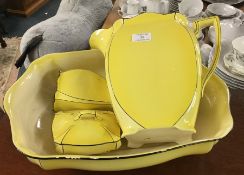 A stylish yellow jug and basin set.