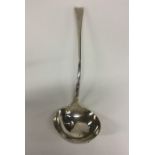 A Georgian OE pattern silver bottom marked ladle.
