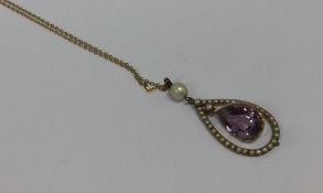 An attractive amethyst and pearl drop pendant on g