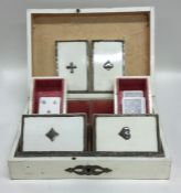 An unusual hinged top card box with fitted interio