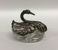 A silver and glass mounted model of a swan with ou