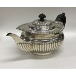 A good silver Georgian style half fluted teapot on