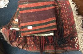 Old rugs and a tapestry bag.