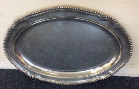 A massive Georgian silver oval meat dish with gadr