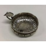 An Antique silver wine taster with coin inset to b