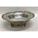 A silver sweet dish with splayed legs. London. App