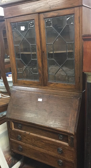 An oak lead glazed bureau bookcase.