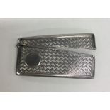 An engine turned silver hinged top card case with
