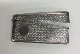 An engine turned silver hinged top card case with