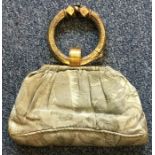 A silver gilt and embroidered handbag.