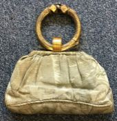 A silver gilt and embroidered handbag.