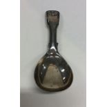 A fiddle and thread pattern silver caddy spoon. Bi