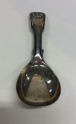 A fiddle and thread pattern silver caddy spoon. Bi