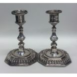 A pair of Victorian silver candlesticks with reede