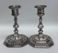 A pair of Victorian silver candlesticks with reede