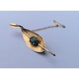 An unusual 14 carat gold opal mounted brooch in th