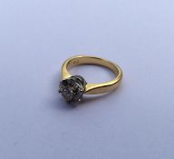 A diamond single stone mounted as a ring in 18 car