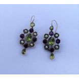 SUFFRAGETTE: A pair of 9 carat drop earrings with